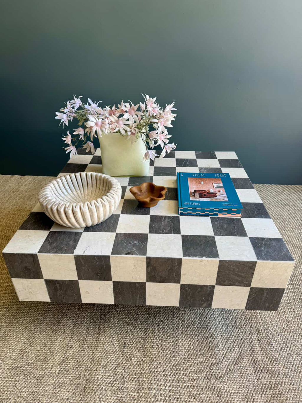 HC Homewares rectangular coffee table with a black and cream checkered stone pattern styled in a modern home.