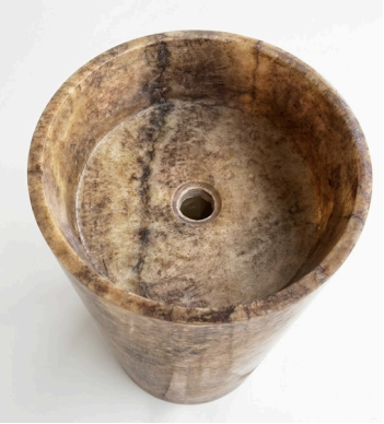 A round stone pedestal basin with a natural marble-like texture in earthy brown, beige, and gray tones.