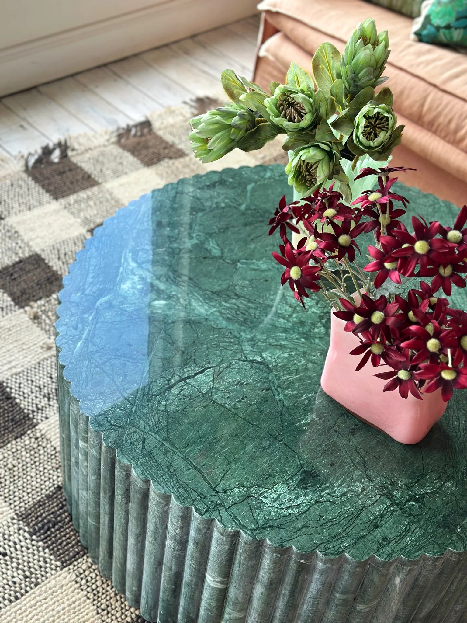 A close up of HC Homewares green marble fluted coffee table, showcasing all its natural, unique features.