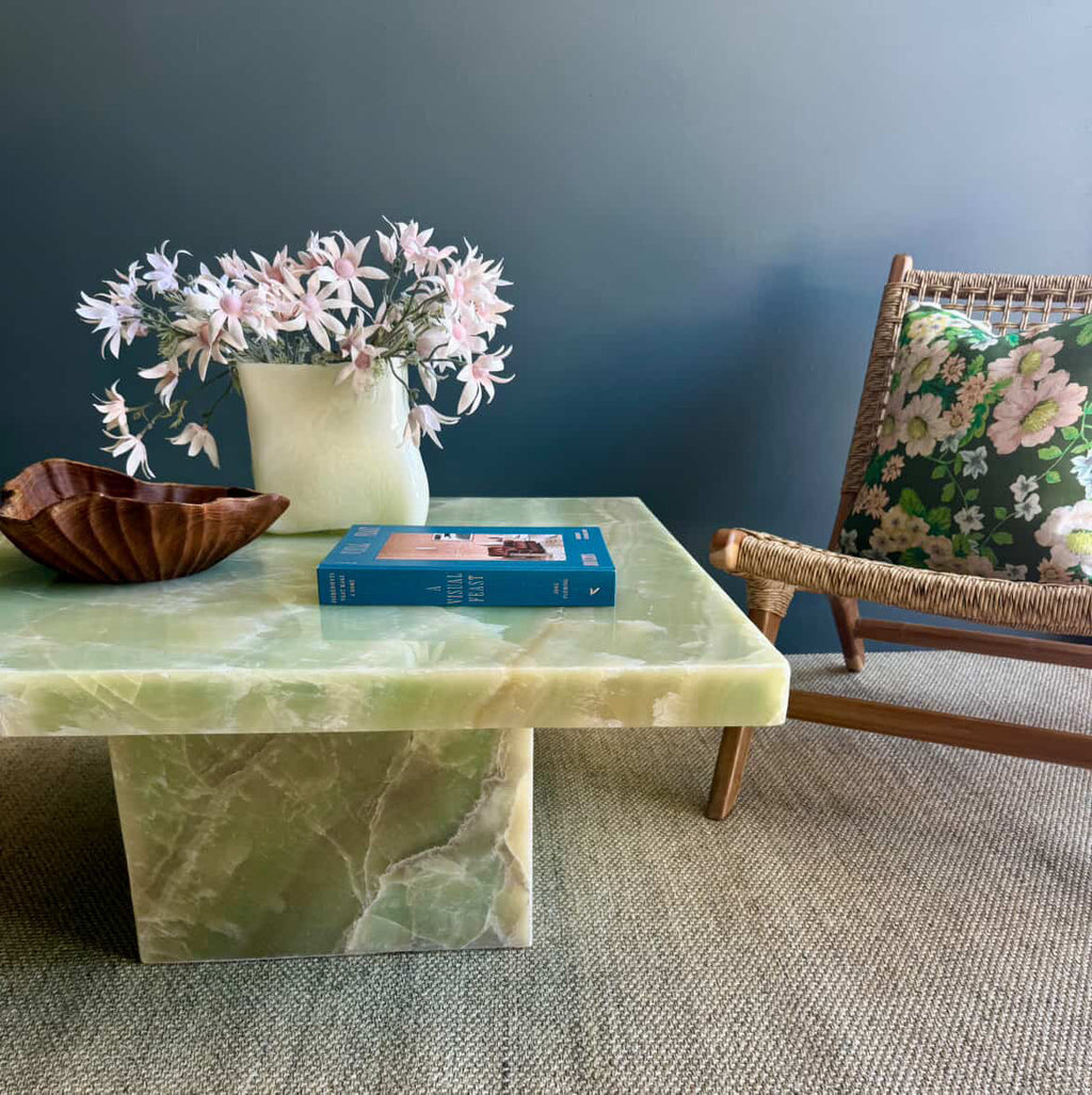 A close up of HC Homewares green marble coffee table, showcasing the natural onyx stone and its unique features.
