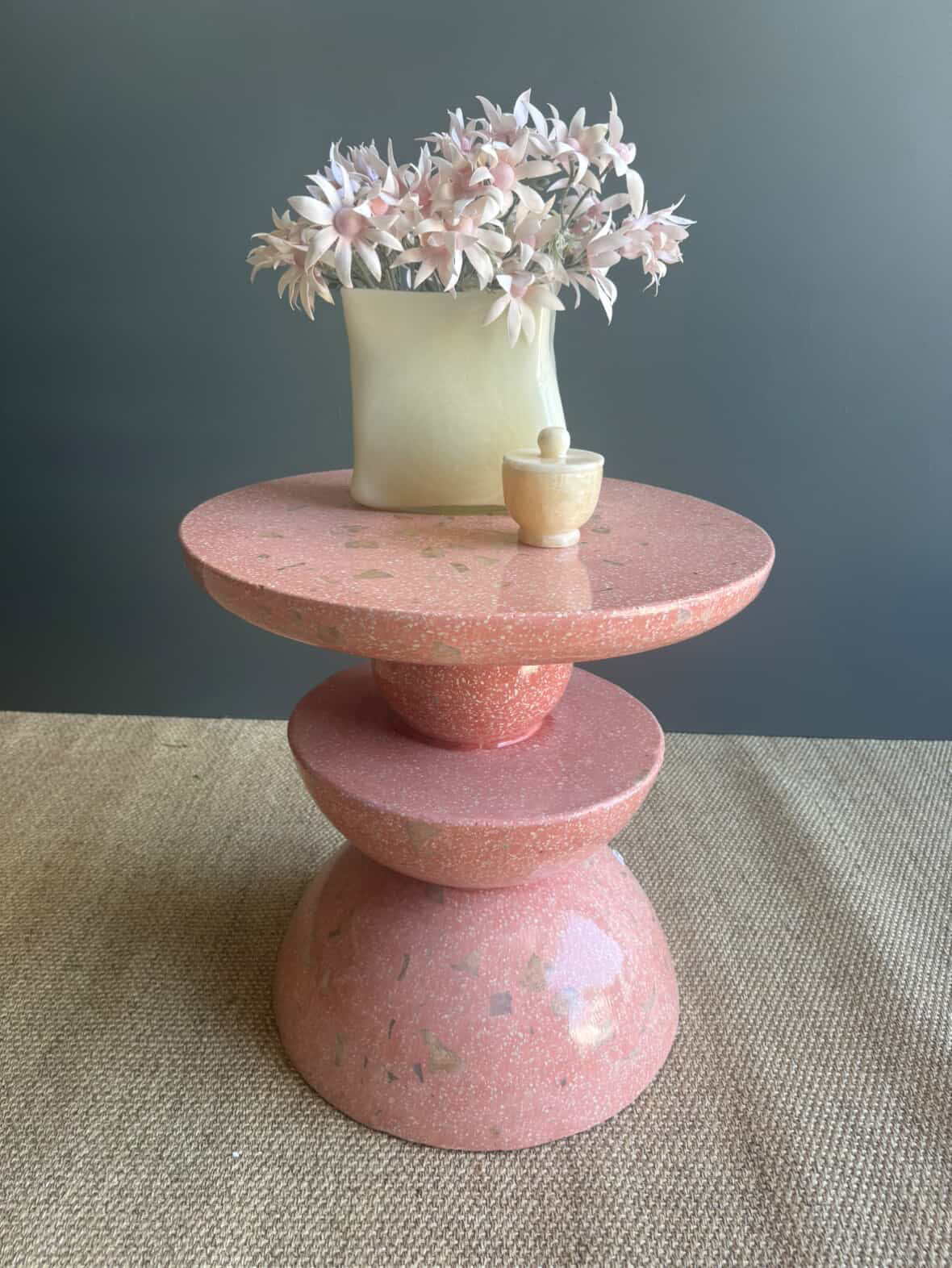 HC Homewares pink, onyx stone pedestal table with a round top, designed to bring warmth and authenticity into your home.