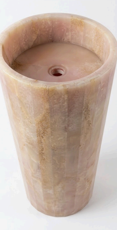 HC Homewares cylindrical stone pedestal basin in a warm beige and brown marbled finish.